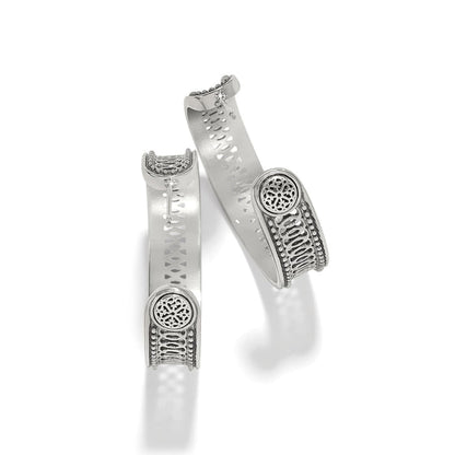 Brighton hinged cuff bracelets with silver-plated finish, openwork medallion accents, and beaded detailing on a white background