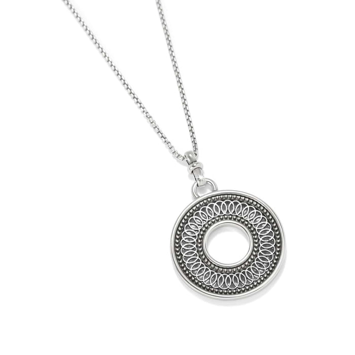 Brighton pendant necklace with silver-plated open circle medallion featuring intricate beaded and looped detailing on a white background
