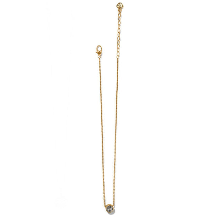 Ferrara Two Tone Luce Mini Pendant Necklace with an adjustable chain and a round pendant featuring a decorative motif lies against a white background.