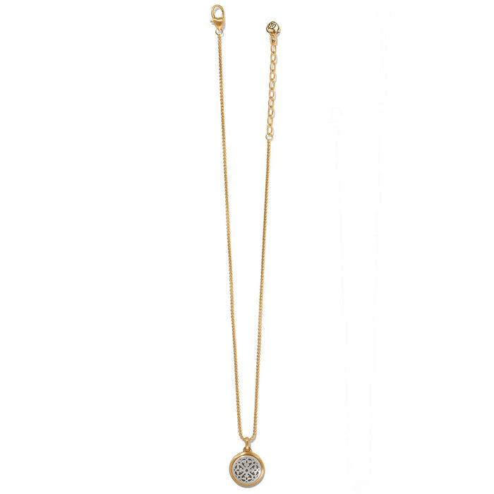 Brighton pendant necklace with brushed gold-plated chain and silver-plated round medallion with openwork detail on a white background