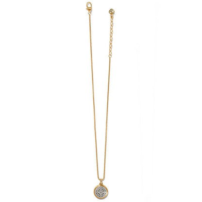 Brighton pendant necklace with brushed gold-plated chain and silver-plated round medallion with openwork detail on a white background