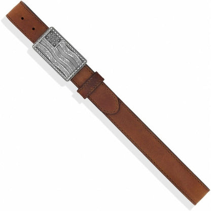 Brighton brown leather belt with silver-tone American flag engraved buckle and stitched edges on a white background