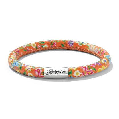 Brighton bracelet with orange floral print leather and silver-plated magnetic clasp engraved with logo on a white background