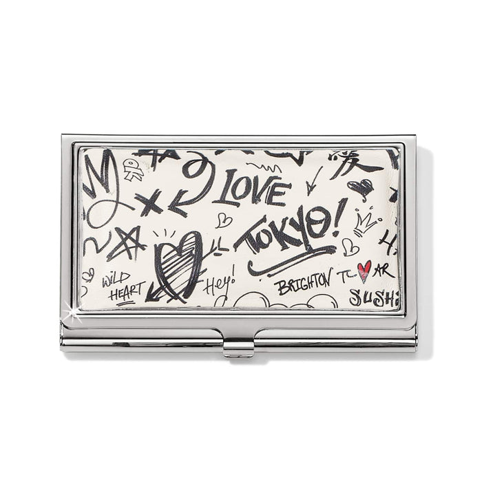 Brighton business card case with silver-tone frame and black graffiti-style print featuring hearts and text on a white background