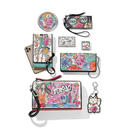 Brighton accessories collection styled with illustrated Tokyo-themed handbags and coordinating small accessories on a white background