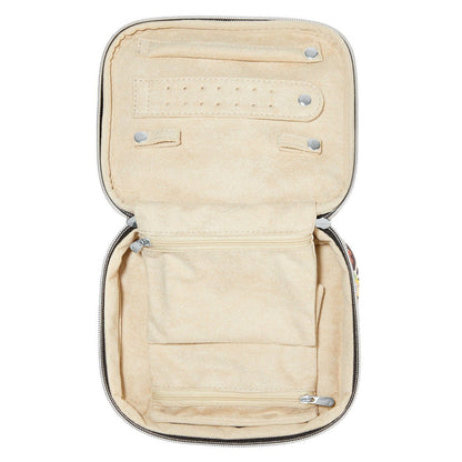 Brighton jewelry case shown open with beige velvet interior, ring rolls, snap closures, and zippered pockets on a white background