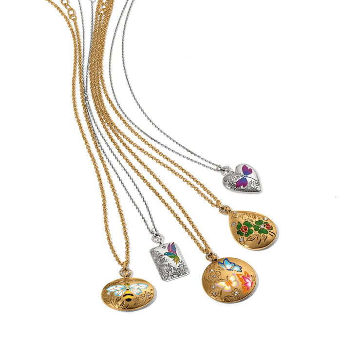 Brighton pendant necklaces with enamel butterfly, bee, hummingbird, ladybug, and heart designs and crystal accents on a white background