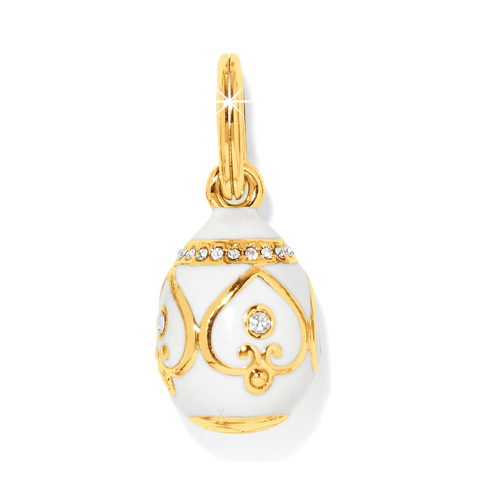Brighton egg-shaped charm pendant with white enamel, gold-plated scrollwork, and crystal accents on a white background