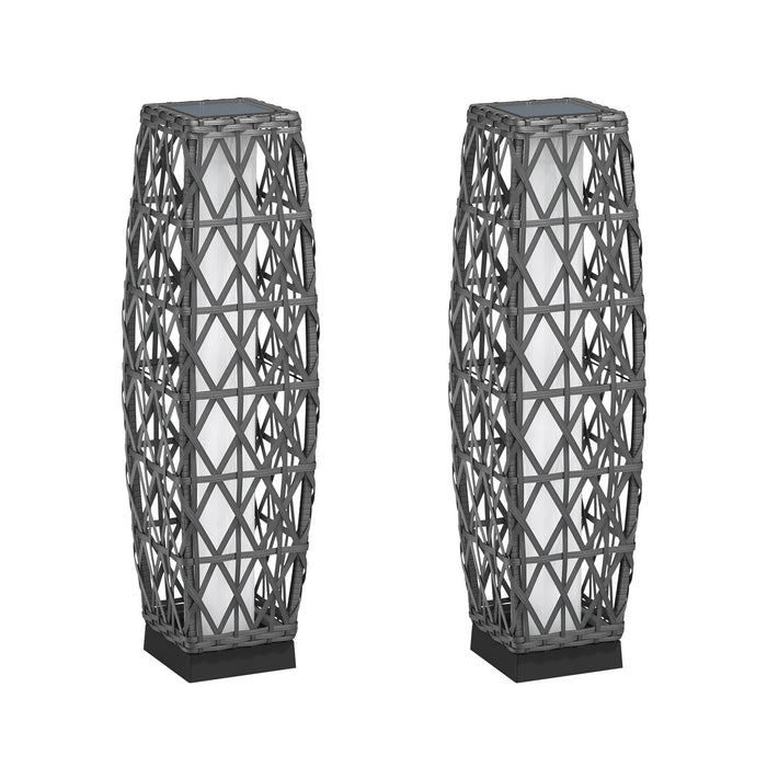 Two geometrically patterned floor lamps on a white background