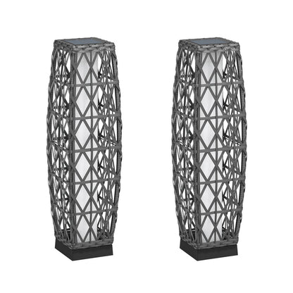 Two geometrically patterned floor lamps on a white background