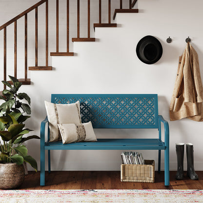 Durable garden bench with a teal anti-rust steel frame and floral lattice design, placed near a staircase and plants.