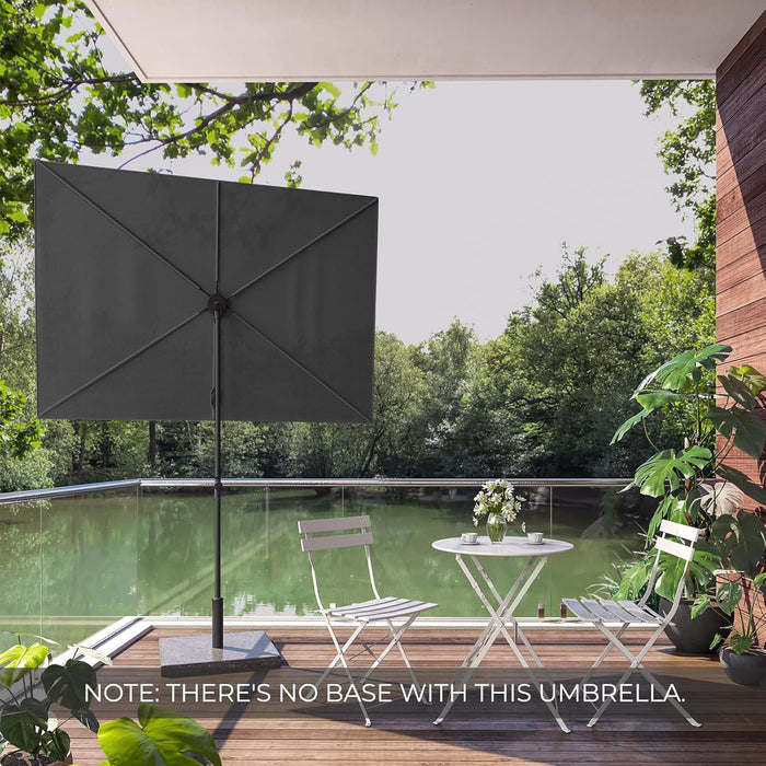GRAND PATIO JENA 6x4 FT rectangular flat patio market umbrella in dark gray, set on a wooden deck by a green lake.