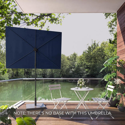 Grand Patio Jena 6x4 ft rectangular flat patio market umbrella in navy blue, set on a deck overlooking a green landscape.