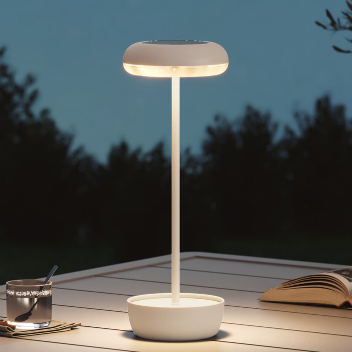 White LED desk lamp on a wooden surface with a dark background
