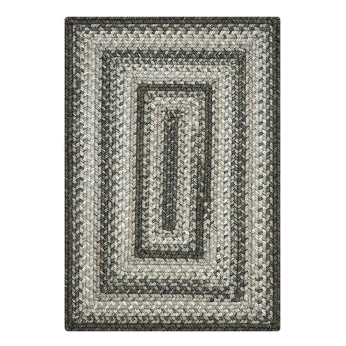 Rectangular braided rug with a striped pattern on a white background