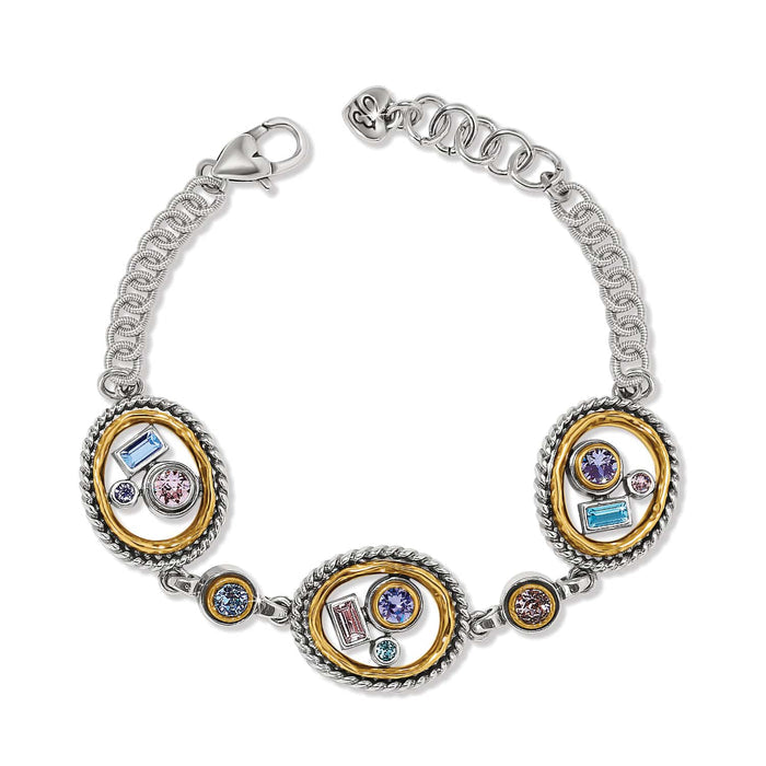 Brighton two-tone bracelet with three oval stations featuring multicolored crystals and chain links on a white background