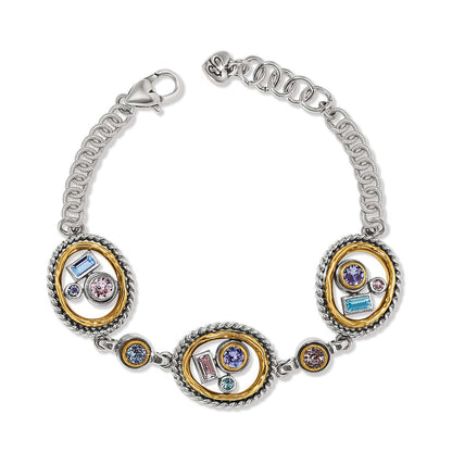 Brighton two-tone bracelet with three oval stations featuring multicolored crystals and chain links on a white background