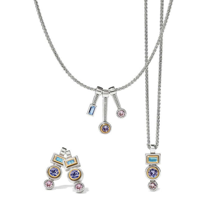 Brighton jewelry set styled with two-tone silver chain necklaces and matching earrings featuring blue, purple, and pink crystals