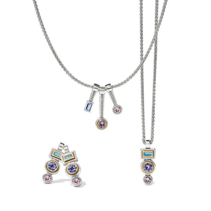 Brighton jewelry set styled with two-tone silver chain necklaces and matching earrings featuring blue, purple, and pink crystals