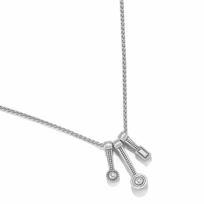Brighton pendant necklace with three measuring spoon charms featuring crystal accents on silver-tone chain on a white background