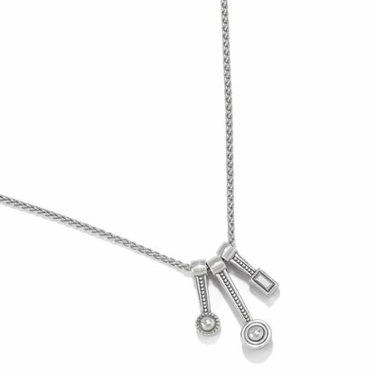 Brighton pendant necklace with three measuring spoon charms featuring crystal accents on silver-tone chain on a white background