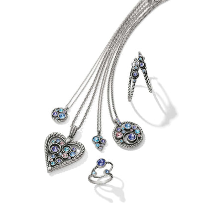 Brighton silver-plated jewelry set styled with heart pendant necklaces, hoop earrings, and rings with multicolor crystals