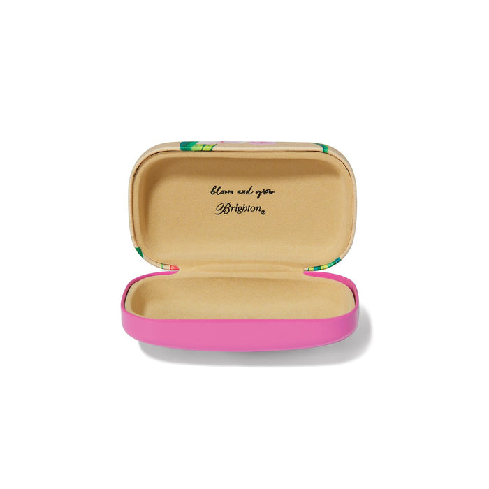 Brighton case shown open with pink exterior and tan lined interior printed with bloom and grow on a white background