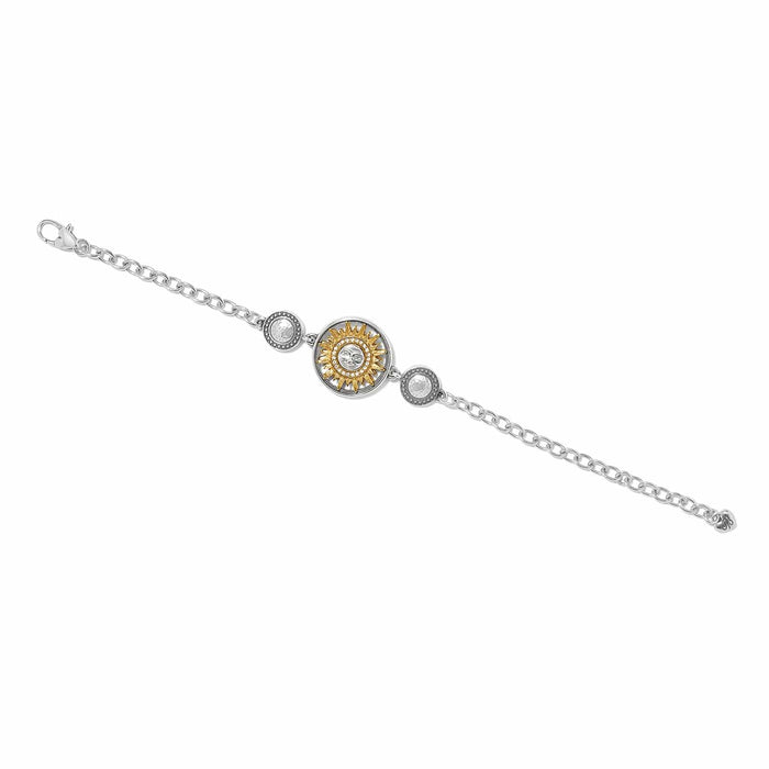 Brighton two-tone bracelet with gold sun medallion, crystal accents, and silver chain links on a white background