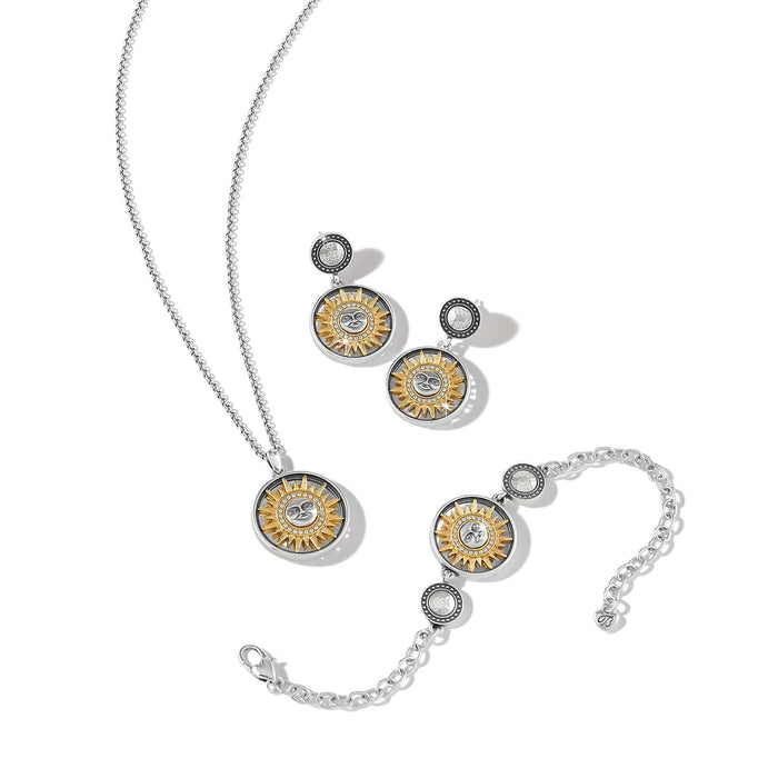 Brighton jewelry set styled with matching sun-motif necklace, earrings, and bracelet in two-tone finish with crystal accents