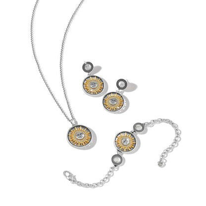 Brighton jewelry set styled with matching sun-motif necklace, earrings, and bracelet in two-tone finish with crystal accents