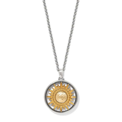 Brighton pendant necklace with two-tone sunburst medallion and hammered gold-tone center on a white background