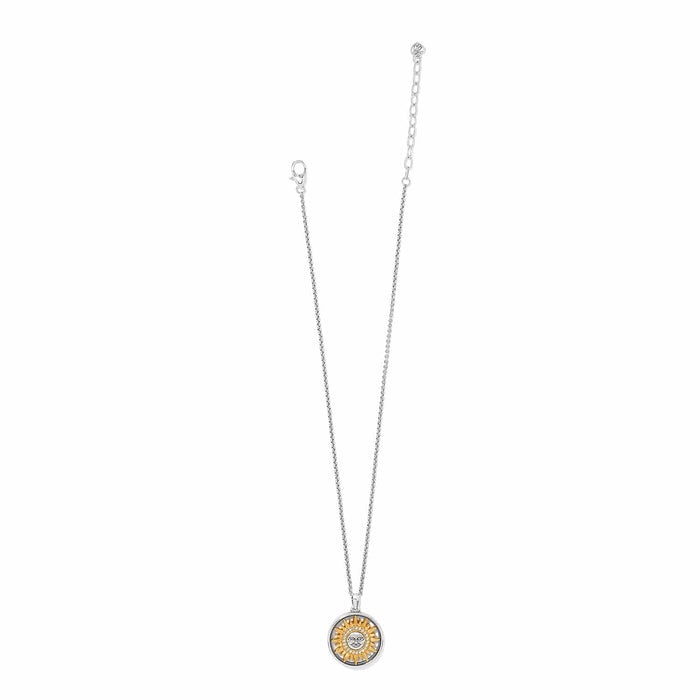 Brighton pendant necklace with two-tone sun medallion featuring crystal accents on silver-tone chain on a white background