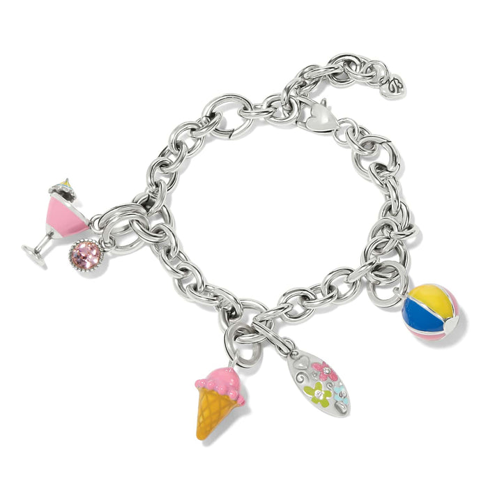 Brighton silver-plated charm bracelet with enamel ice cream, cocktail, beach ball, and floral charms on a white background