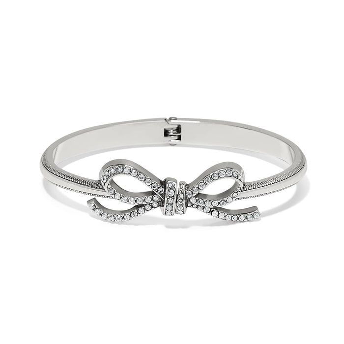 Brighton bangle bracelet with silver-plated finish and crystal-encrusted bow centerpiece on a white background