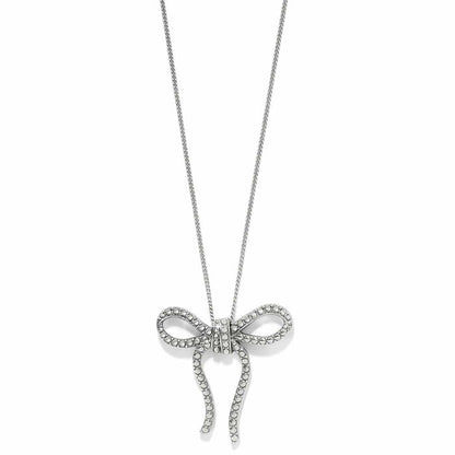 Brighton pendant necklace with silver-plated beaded bow design and dangling ribbon ends on a white background