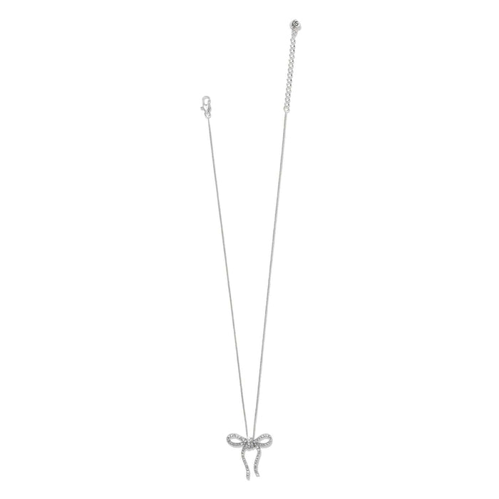Brighton silver-plated necklace with crystal-encrusted bow pendant and adjustable chain on a white background