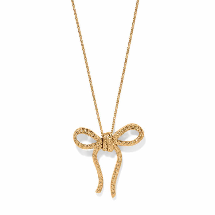 Brighton pendant necklace with gold-plated textured bow charm on a delicate chain on a white background
