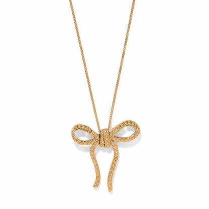 Brighton pendant necklace with gold-plated textured bow charm on a delicate chain on a white background