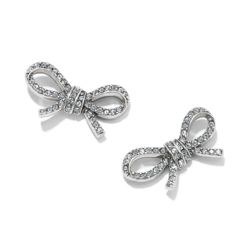 Brighton stud earrings shaped like silver-plated bows with pavé crystal accents and knotted centers on a white background