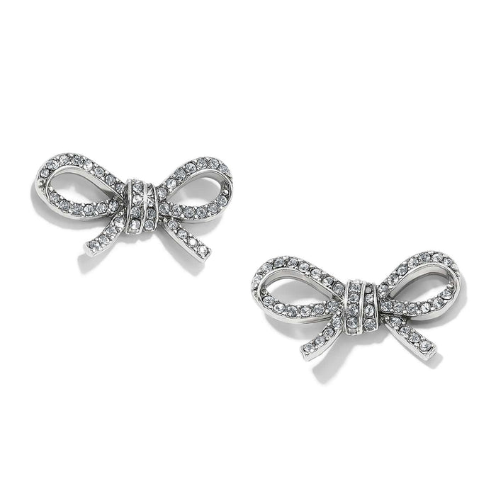 Brighton stud earrings shaped like silver-plated bows with pavé crystal accents and ribbon detailing on a white background
