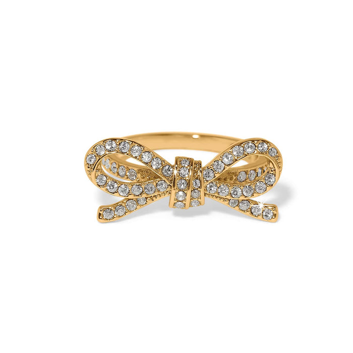 Brighton ring with gold-tone bow design and pavé crystal accents across ribbon loops on a white background