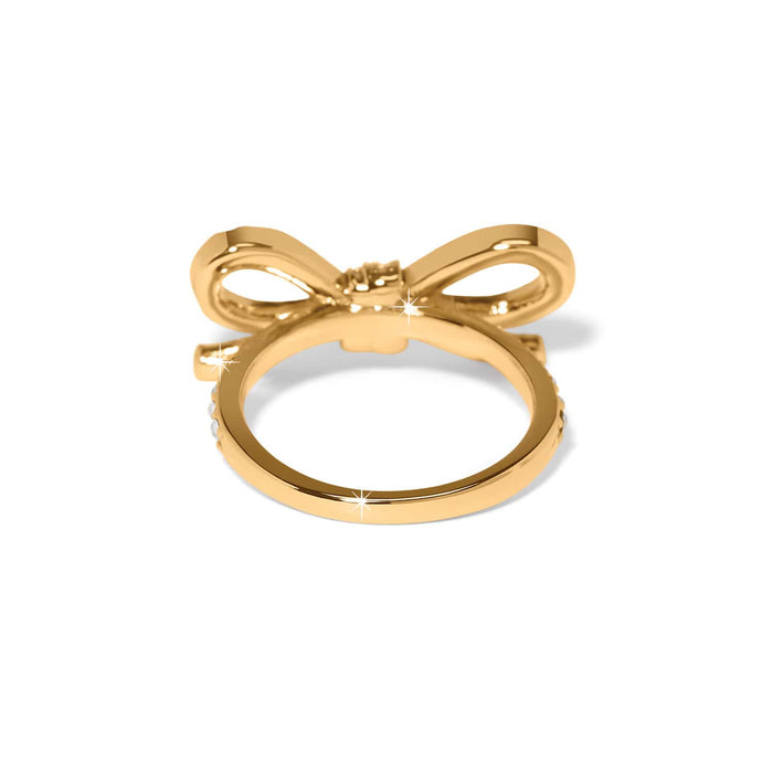Brighton ring shown from the back with gold-tone bow design and crystal-accented band on a white background