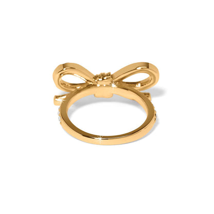 Brighton ring shown from the back with gold-tone bow design and crystal-accented band on a white background