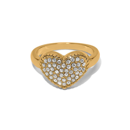 Brighton heart ring with gold-tone band and pavé crystal heart-shaped face on a white background