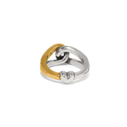 Brighton interlocking rings in two-tone gold and silver finish with heart detail on a white background