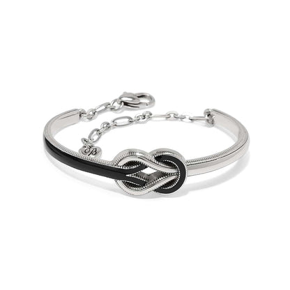 Brighton bracelet with silver-plated knot centerpiece, black enamel accents, and adjustable chain clasp on a white background