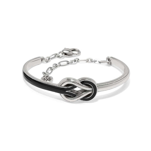 Brighton bracelet with silver-plated knot centerpiece, black enamel accents, and adjustable chain clasp on a white background