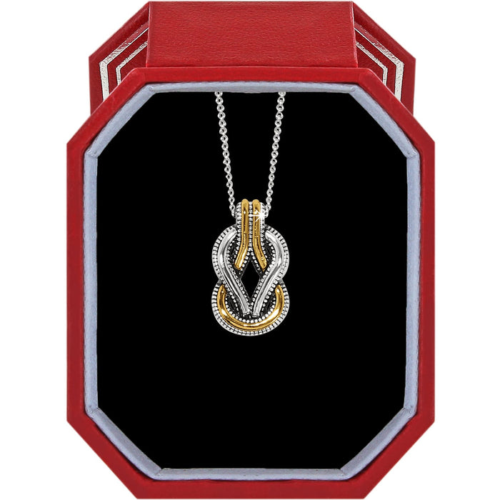 Brighton two-tone knot pendant necklace with silver and gold interlocking loops displayed in a red gift box