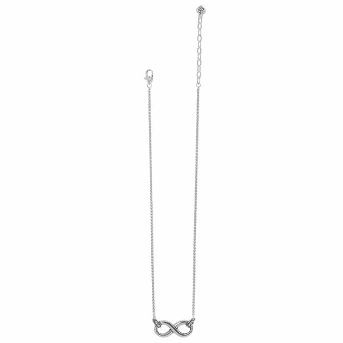 Brighton silver-plated necklace with infinity pendant, delicate chain, and lobster clasp on a white background