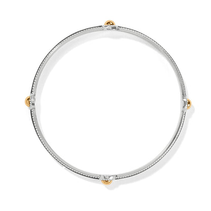 Brighton bangle bracelet with silver-tone enamel band and four gold-tone ball accents on a white background